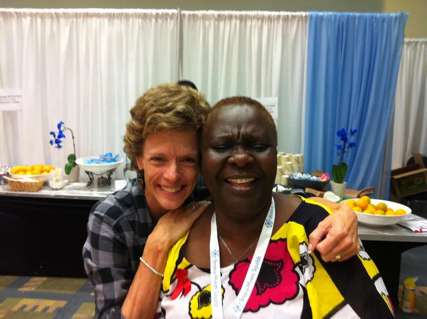 Kathy and a friend smiling together during a visit to Kenya